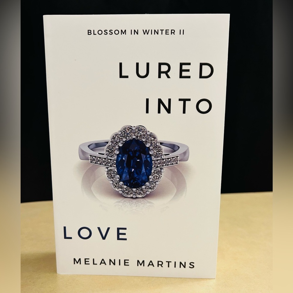 Lured Into Love Book Two Blossom in Winter Series By:Melanie Martins Signed Copy